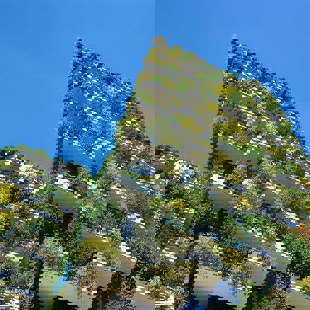 A building with trees and bushes.