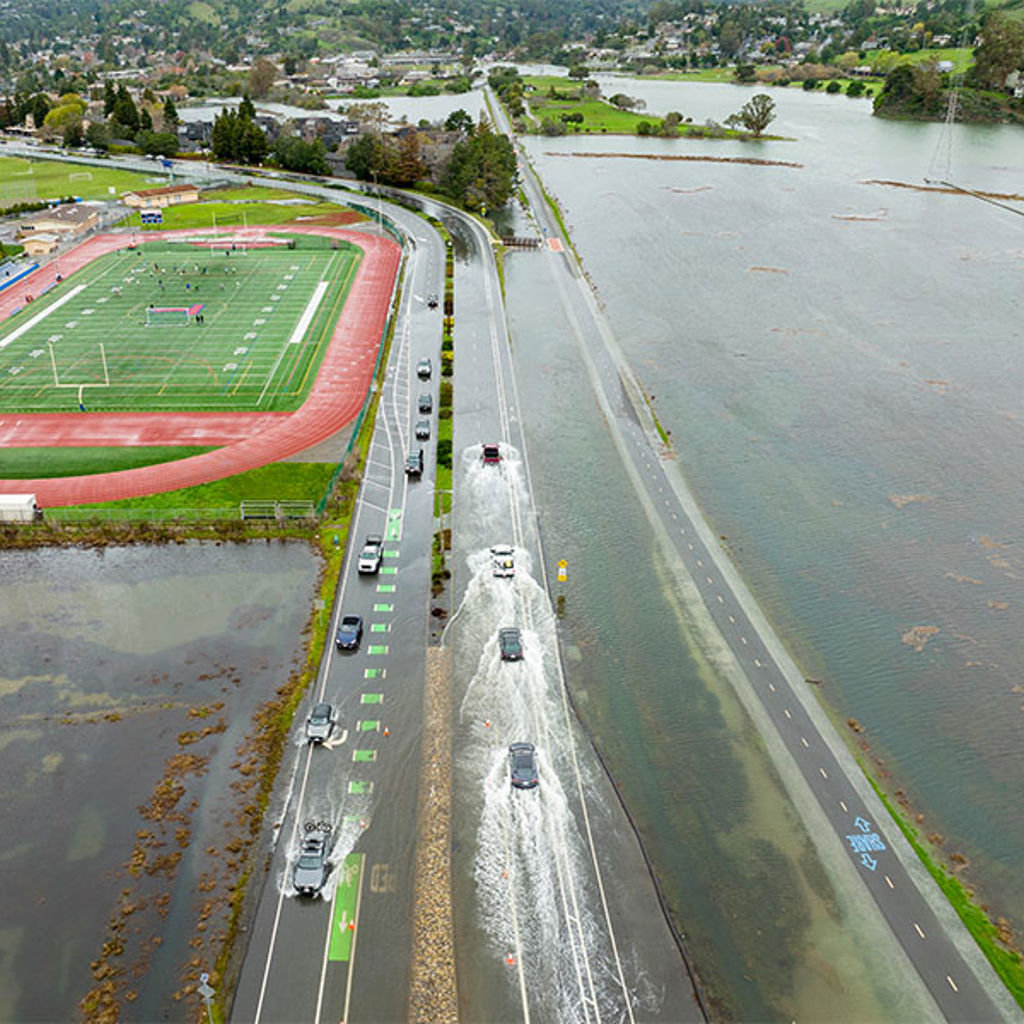 Cars driving on flooded highway in Marin County