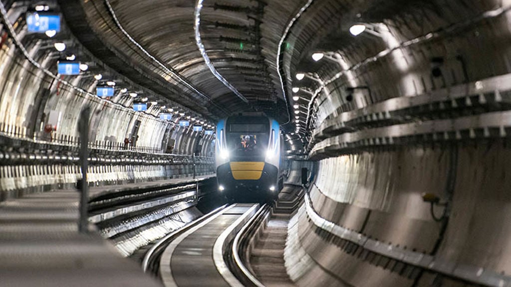 A train moving along the tracks inside a metro tunnel