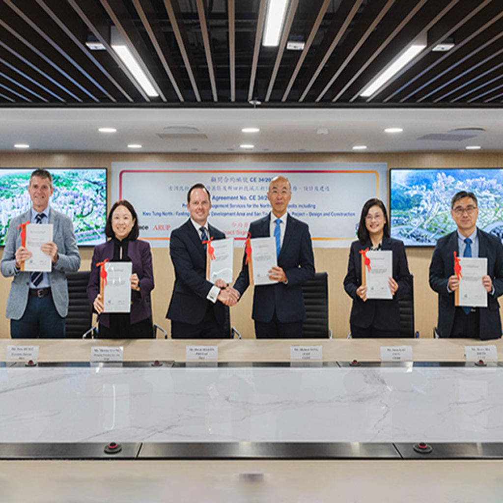 A group of people holding papers.