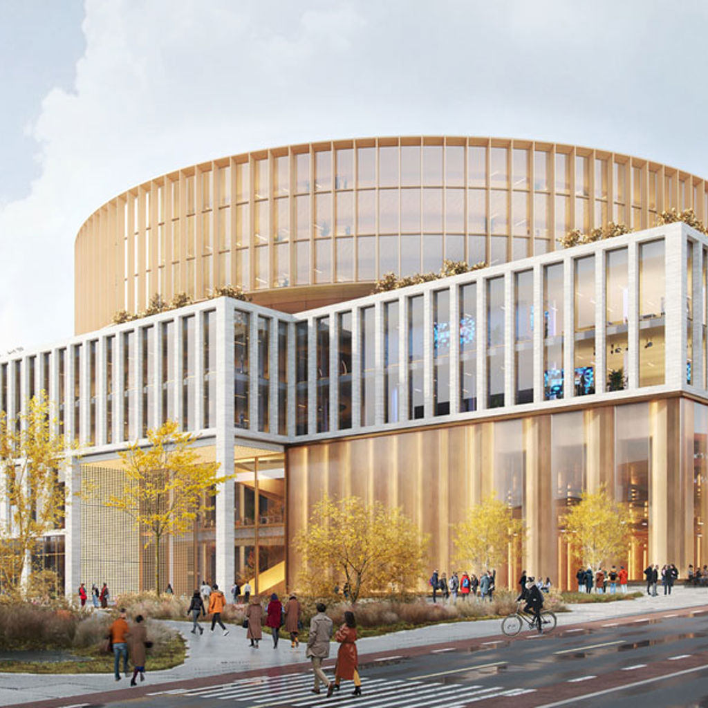 A large building with people walking around.