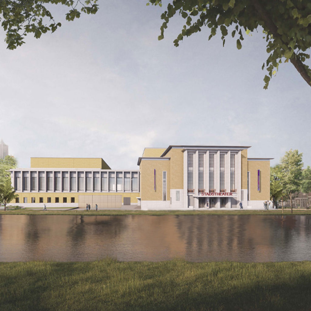 A building with a pond in front of it.