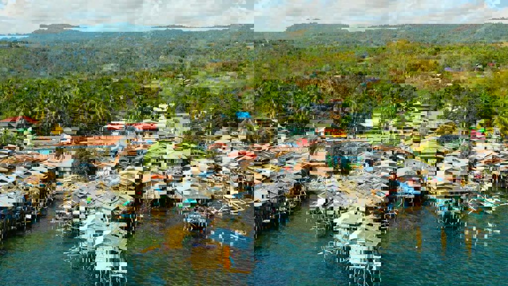 Wooden houses built on the river in a low socio-economic neighbourhood in an Asian city