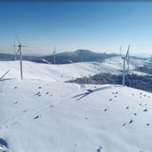 Wind turbines on a mountain in the snow
