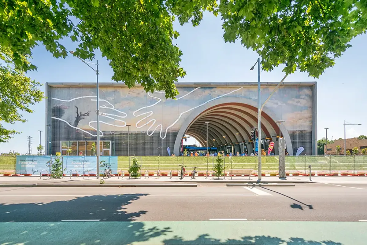 The building at Arden Station has a large tunnel section cutout and artwork on its exterior