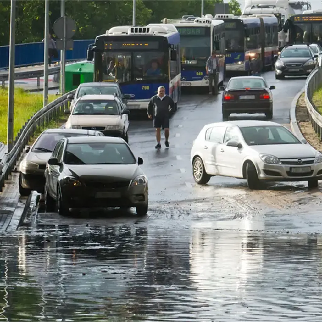 Flooding under a bridge blocking a road
