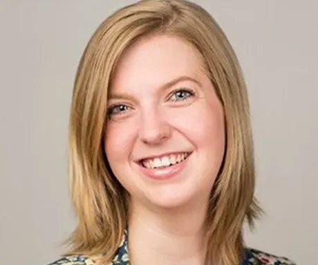 A woman smiling for the camera.