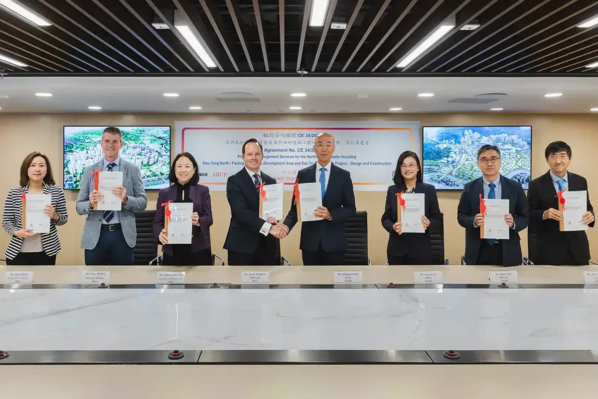 A group of people standing in front of a display.