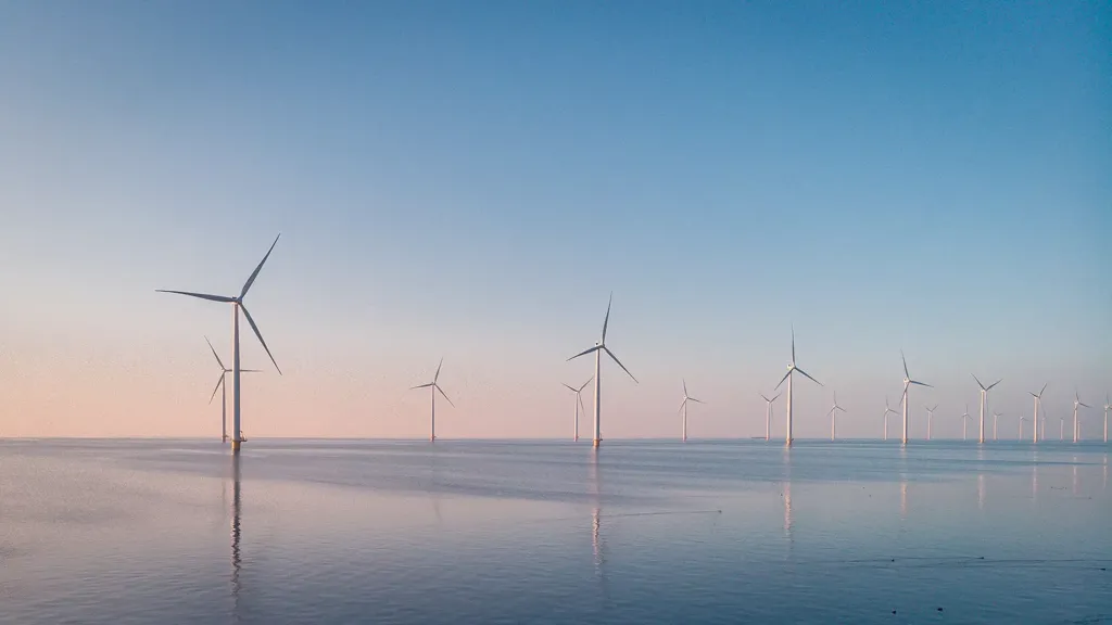 A group of wind turbines in a body of water.