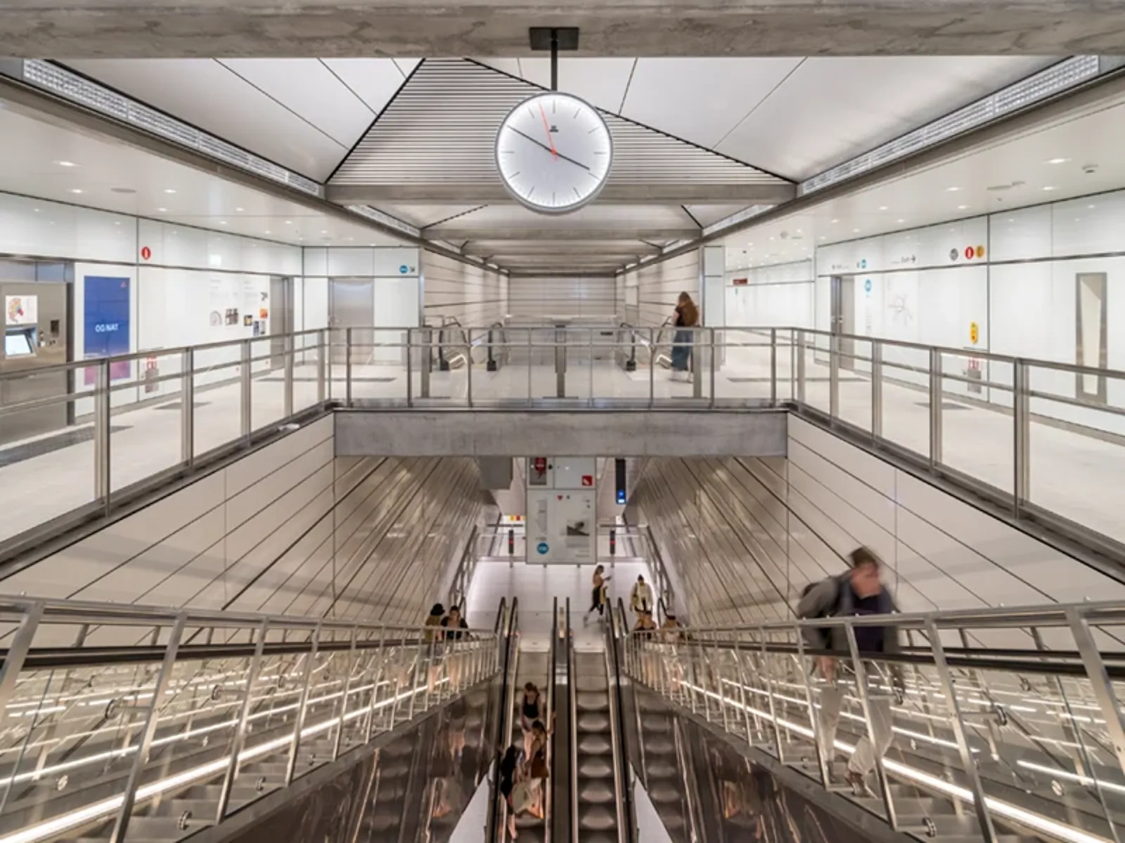Passengers riding an escalator